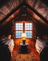 With their lofty vaulted ceilings and charming windows. Cozy Attic Guest Room Cabin Living Cabin Interiors Cabin Bedroom