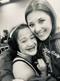 What does it mean to be a female wrestler in District 3?