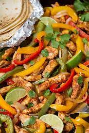 Pour two tablespoons of vegetable oil over your chicken and veggie mixture, giving it a good toss, making sure the veggies and chicken are coated evenly with the seasoning and oil. Easy Chicken Fajitas Oven Baked On Sheet Pan Cooking Classy