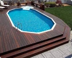 Limit the custom pool features such as a spa, baja shelf, etc. 15 Awesome Above Ground Pool Deck Designs Intheswim Pool Blog