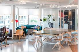 Zoku Work And Living Area Ping Pong Desk With Lounge Areas And Sofas Live Work Space Living Spaces Zoku Amsterdam