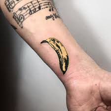 Her body is covered in tattoos featuring over forty corporate logos and brand names. Facebook