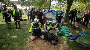 Scuffles broke out as police arrested several people after city of toronto crews began dismantling a homeless encampment at lamport stadium near king street west and dufferin street on. R4ofglj33mzvem