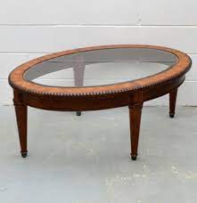 In our family since purchase. Lot Art Vintage Oval Coffee Table With Glass And Leatherette Details