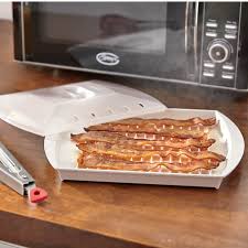 Cooking bacon in the microwave is one of the easiest ways to prepare it, and also creates far less mess than cooking bacon on the stovetop. Progressive Microwave Bacon Grill With Cover Montgomery Ward