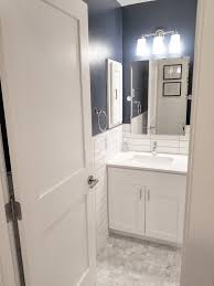 white vanity blue walls pivot mirror subway tile half walls small 5x8 bathroom stacked b bathrooms remodel diy bathroom remodel white subway tile bathroom
