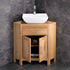 A bathroom vanity can be used to jazz up a corner of your home that is often overlooked. Double Door 780mm Oak Corner Vanity Unit Rectangular Basin