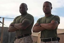 Chicago native Sgt. Quinton King stands beside one