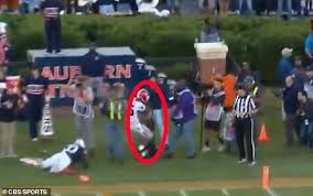Photographer Is Knocked Unconscious By College Running Back