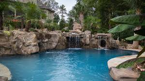 Waterfall coolest backyard pools with slides. Slide Grotto Options For Different Budgets