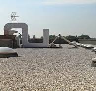 Why Put Gravel on a Flat Roof - The Purpose of Gravel on ...