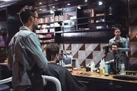 Long bob hairstyles new haircuts curly lob haircut modern haircuts longer lob haircut lob haircut straight wedding hairstyles blonde these timeless haircuts look flattering at any age. Barber Showing Man Haircut In Mirror In Barber Shop Bottles Beauty Product Stock Photo 225312864