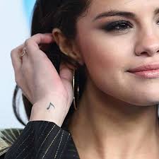 6 Selena Gomez Outfits You Can Actually Afford And Where To Buy Them Selena Gomez Tattoo Hidden Tattoos Music Tattoos