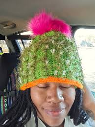 Juan is not pleased with the new hobby of its human 😡 [this was supposed  to be a hat, my first time crocheting lmaooo]