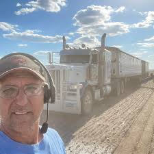 Our super wonderful UPS driver Adam and Enyo our Doberman! Enyo loves Adam  and is thankful he delivers her food! Dunbar, Pa.