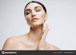 Brunette facial skin care rejuvenation light background Stock Photo by  ©ShotStudio 513554042