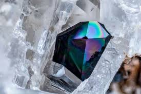 A Beautiful Black Allanite Ce Crystal Grown In A Cavity Formed By The Interlacing Of White Shiny Crystals Of San Crystals Crystals Minerals Rocks And Gems
