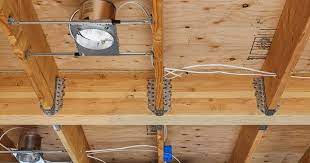 A Recessed Light Installed Between Two Floor Joists In A Ceiling Installing Recessed Lighting Recessed Lighting Basement Lighting
