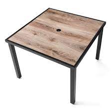 A traditional top gives this square farmhouse table a rustic touch. Mainstays Heritage Park Outdoor Square Steel Dining Table Brown Black Walmart Com Walmart Com