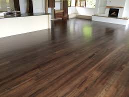 coloured matai floor stained with a dark walnut stained reduced down to avoid the floor going too dark the floor was fin floor stain flooring timber flooring