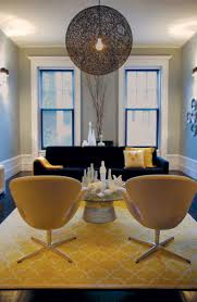 This yellow living room features a soft, buttery yellow accompanied by a relaxing powder blue. Yellow Trellis Rug Contemporary Living Room Graham Moss