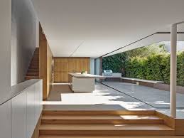 Complimenting materials of concrete, continuous length floor boards and a restrained palette of black aluminium, black steel, stainless steel and oak appear throughout the house and create a cohesive connection between original and new. Nobbs Radford Architects I Sydney
