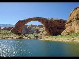 Rainbow bridge, on the edge of lake powell, is the largest natural bridge in the world at 290 feet/88 meters tall and 270 feet/83 meters across. Lake Powell Rainbow Bridge Youtube