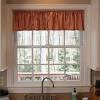 A metal mesh curtain provides a subtle division between work and living areas. 1