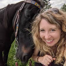 Boomer (8PM66) reading the Equus magazine article about how awesome  Standardbreds are!