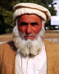 Which Muslim men wear head coverings?