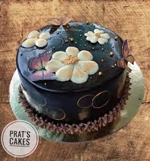 Uncommon goods blooming lollipops, $20 for 8, uncommongoods.com Dutch Chocolate Cake With Edible Butterfly And Chocolate Flowers In Pune All India Delivery Cakexpo