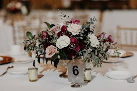 Burgundy bridal bouquets, burgundy floral arrangements and burgundy wedding inspiration. Michigan League Reception Centerpiece By Red Poppy Floral Design Burgundy Wedding Flowers Centerpieces Red Wedding Centerpieces Burgundy Floral Centerpieces
