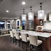 Whether you're looking for lights for kitchen islands or hanging lights for above a bathroom vanity, pendants are a versatile design option. 1