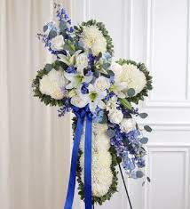 Share condolences with a beautiful funeral vase arrangement today. Peace Prayers Blue White Standing Cross Funeral Floral Arrangements Funeral Floral Funeral Flower Arrangements