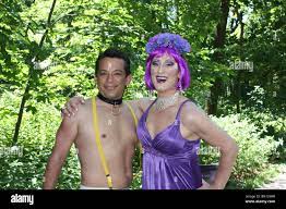 gay man crossdresser transgender purple topless Stock Photo - Alamy