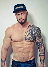 Tribal tattoo on chest and left half sleeve. 61 Stylish Tribal Tattoos On Chest