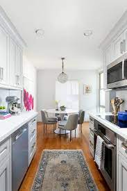 Before this galley kitchen is remodeled the design was really old makes the quarters cramped. Galley Style Kitchen Design With Dining Table And Chairs Transitional Kitchen
