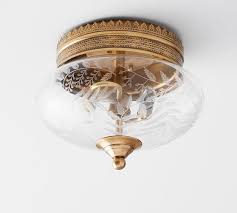 Hundreds of capiz petals form a luminous lotus flower on our flush mount fixture. Elodie Flushmount Pottery Barn
