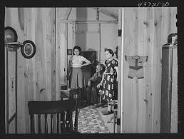 The Edwards family in their prefabricated home at the Hazlehurst Farms  Inc., Hazlehurst, Georgia. They owned a farm in Willie, Georgia in the  Hinesville Army camp area