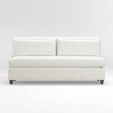 This contemporary armless loveseat is enhanced with gray upholstery and piped seams for a versatile look. Armless Loveseats Crate And Barrel