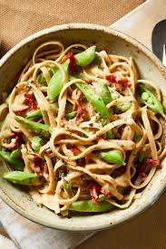 White Bean Fettuccine Alfredo With Peas And Sun Dried Tomatoes Recipe Whole Food Recipes Healthy Pastas Asian Noodle Dishes