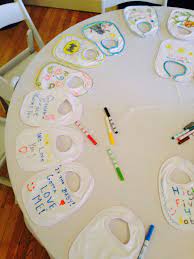 Great Baby Shower Activity Have Guest Write Or Create Pictures For The Baby To Be On Bibs Baby Shower Activities Baby Shower Baby Shower Games