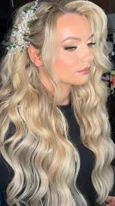 Glowy neutral glam makeup teamed up with glam hair waves too