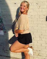 cheesin' bc @taahhnee is opening her own boutique!!! 🥰🤍🏁 •shop @  wizardryclothingco.com ~ no problems tee ~ comfy, but cute flutter shorts  (not the denim😋)