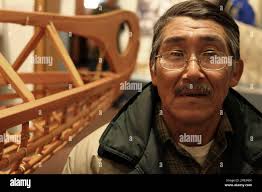 ADVANCE FOR WEEKEND SEPT. 21-22 ** Noah Andrew Sr. of Kwigillingok, Alaska  stands next to a Yup'ik qayaq, or kayak, in Bethel, Alaska, in September  2007. An exhibit of about 80