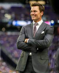 Tom Brady has brought an excellent suit game to his new job.