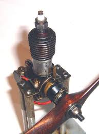 Model spark ignition engines have a set of points (aka, contacts, or timer assembly) which are closed once per revolution by a cam attached to the engine crankshaft. Model Airplane Engine Designers And Builders