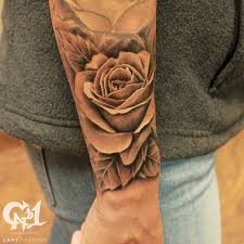 The designs are innumerable and come in brilliant colors. Black And Gray Realistic Rose Tattoo Wrist Tattoo Tattoosbycapone Wrist Tattoos For Guys Rose Tattoos For Men Realistic Rose Tattoo