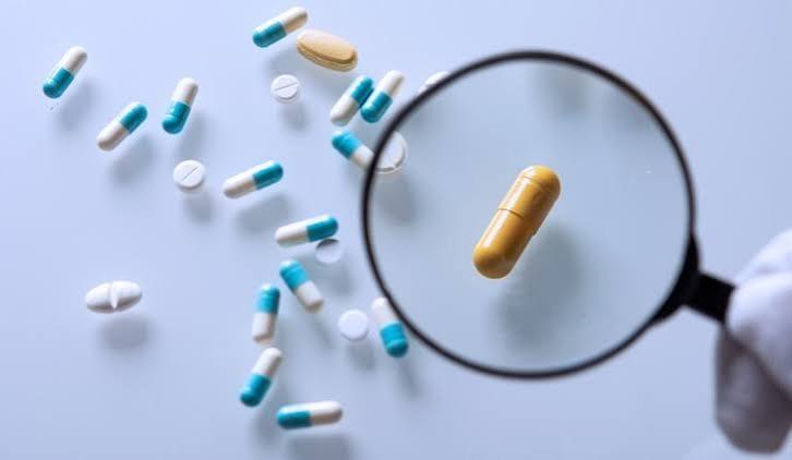 Close-up of pharmaceutical security features including holograms and barcodes used to authenticate medicine
