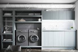 A modern navy laundry room gets a refresh with some updated decor including pillows and here are some incredible small laundry room ideas and designs that pack on efficiency without the need. Modern Laundry Room Interior With White And Brick Walls Gray Stock Photo Picture And Royalty Free Image Image 87045082